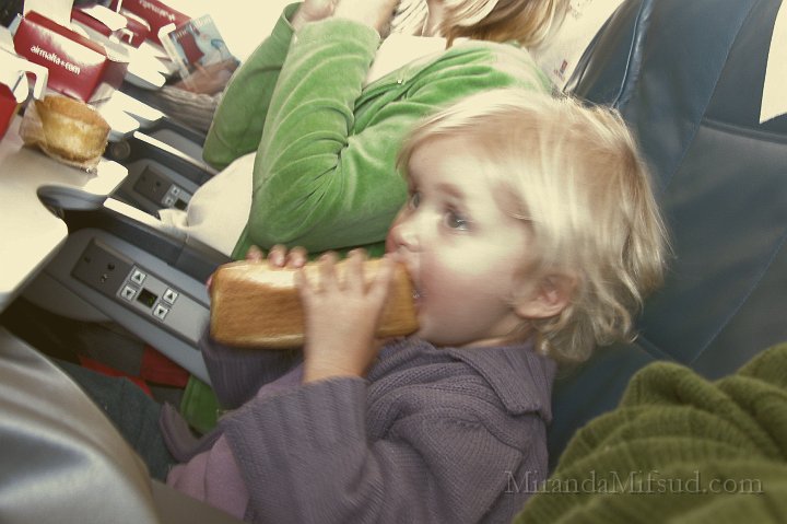 FlightFinland2.JPG - Miranda behaved well on the plane, especially when food was served!